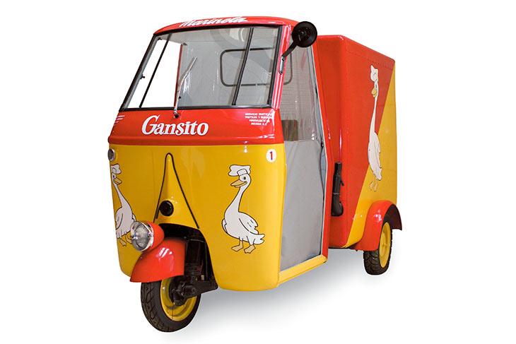 Scooter that had a small cockpit at the front and a large box at the rear.